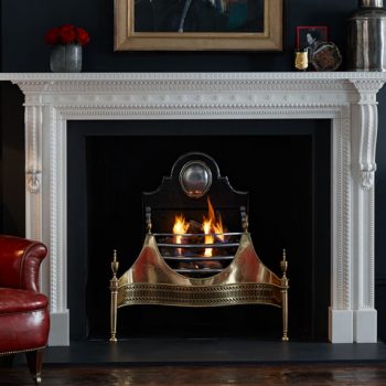 Chesneys Locke fireplace by Robert and James Adam with the Croome fire basket in brass