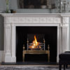 Chesneys Roxburghe fireplace by Robert and James Adam with the Osterley fire basket in brass