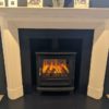 Chesneys Dylan fireplace by Kelly Hoppen with the Salisbury electric stove (large) in black in our showroom