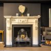 Chesneys Palladian fireplace with Croome Steel fire basket in showroom