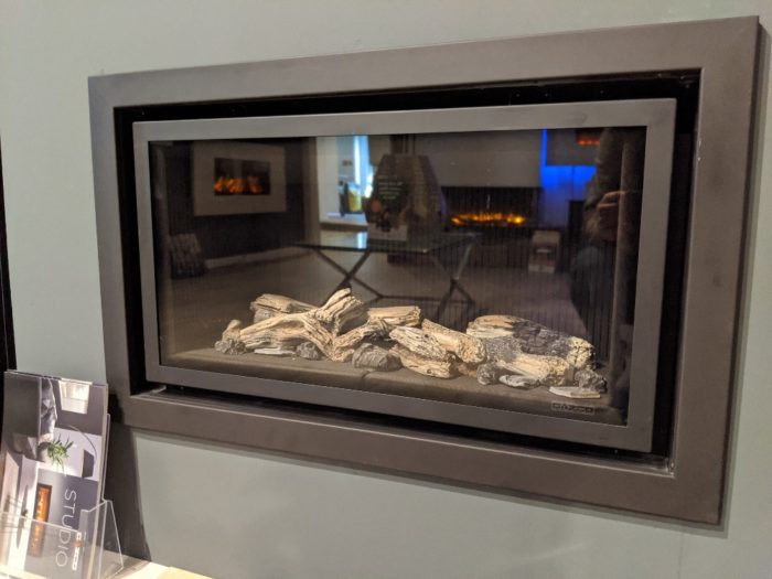 Stovax & Gazco Studio 1 gas fire Profil frame, log effect and black reeded lining in showroom